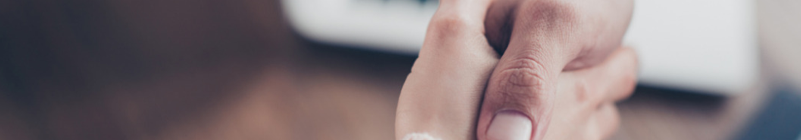 two people engaged in a handshake